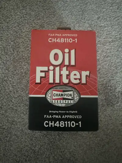 Here's a new Champion CH48110-1 oil filter designed for aviation use, ensuring top-notch engine prot...