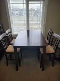 Solid wood dining room table with 4 chairs