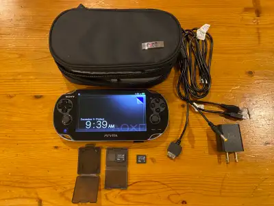 Sony PlayStation Vita w/ case, charger & 2 mem cards, View more