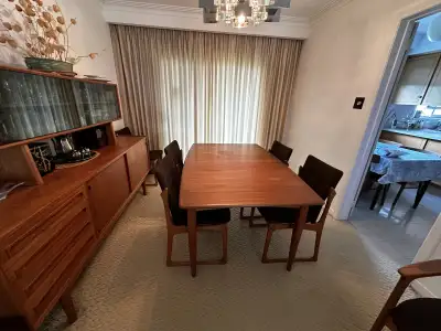 Pure solid Danish teak dining table & 6 chairs ($5,000) & credenza buffet ($4,000). The table is exp...