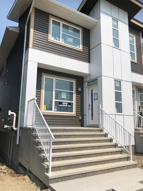 This is a duplex home located in the community of Livingston, north end of Calgary, off Stoney trail...