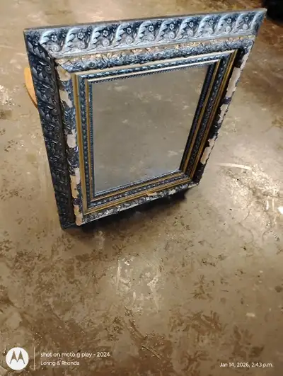 Older mirror needs repair., View more