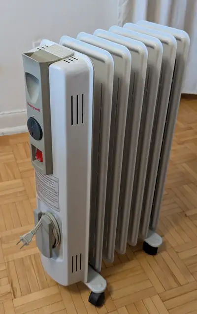 Honeywell Oil Filled Portable Radiator Heater w/Wheels & Thermos, View more
