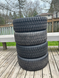 Set of 17 inch Subaru rims and winter tires. 