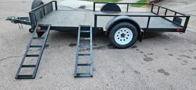 6.5' x 12' Utility Trailer Steel tubing 3500 lb axle Electric brakes Self lubricating bearings Two t...