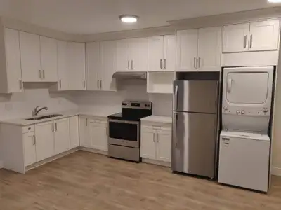 Modern 1 bedroom suite featuring in suite laundry, 1 reserved parking spot in driveway (inside elect...