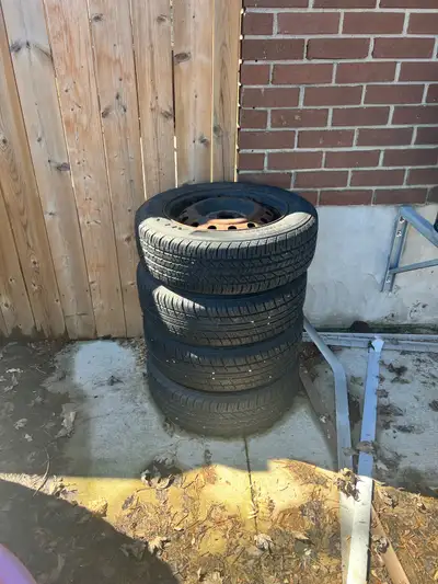 Set of 4 all-season tires mounted on steel rims. Tire size is 195/65R15. Tires still have usable tre...