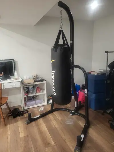 Heavy punching bag (80lbs) and stand, View more