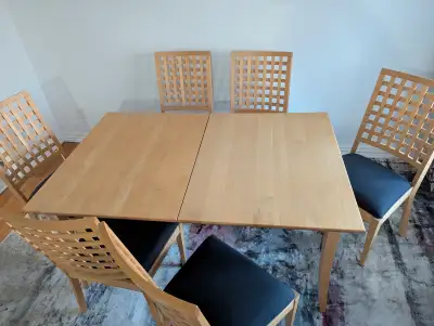Dining table measuring 62 inch length and 40 inch width. Comes with extra extension center pieces an...