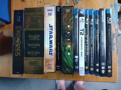 For your consideration, a collection of Bluray movies. $5 Star Wars Ep 7 Terminator 1 T2 Batman Mask...