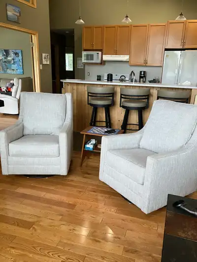 2 Ashley swivel rocking chairs, View more