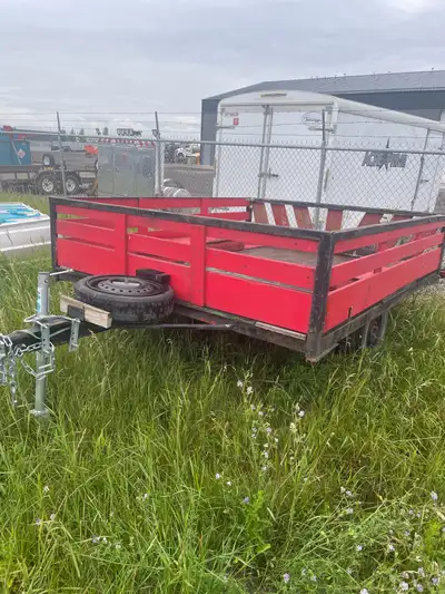 Selling a solid red utility trailer in good condition. Currently registered with a vin numbe. • Box...