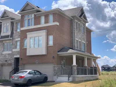 Welcome to 78 Monarch Woods Drive in beautiful Kitchener! This stunning end-unit townhome with a DOU...