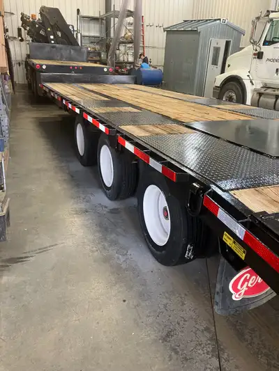 I'm selling a used Cross Country Tridem Tilt deck trailer, perfect for hauling equipment or vehicles...