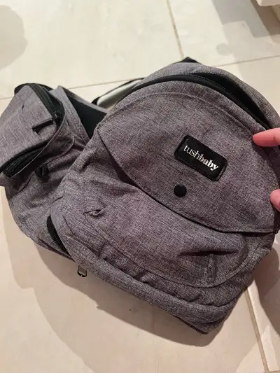 Baby hip carrier. It’s kind of like a little shelf for your infant or toddler. Lots of pockets and a...