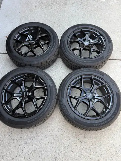 Brand new 16 inch rssw gloss black rims and continental ultimate contact tires amazing set only used...