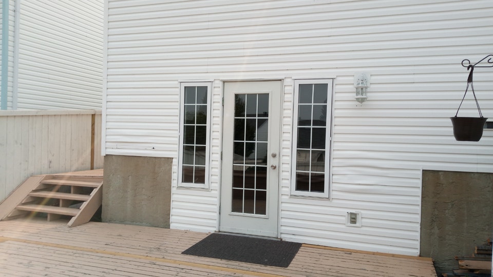 Spacious Split Level 1 Bedroom Basement with Storage & Fireplace 4