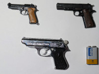 A collection of scale models of various firearms