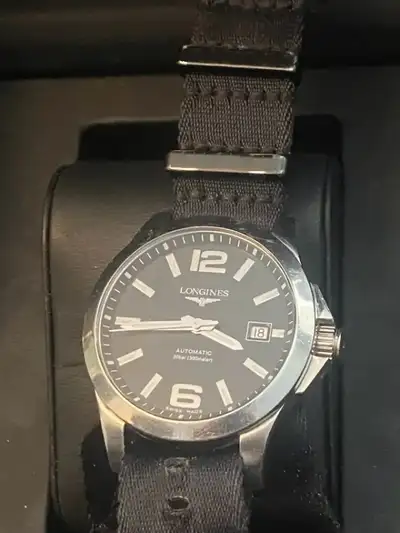 LONGINES Conquest Automatic Black Dial 300m Water Resistant Watch. There are slight scratches and sm...