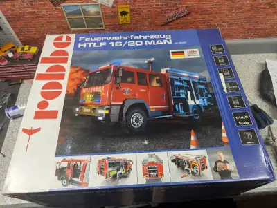 I'm offering a new in box robbe feuerwehrfahrzeug HTLF 16/20 MAN, a highly detailed model fire truck...
