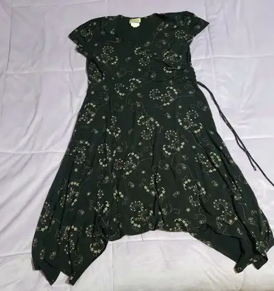 Black with floral design. Close up photo to show design. Has a draw string on the side to tighten. S...
