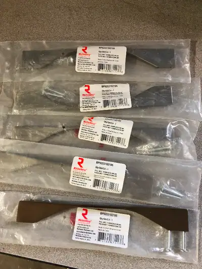 5 new brushed nickel door or drawer handles with various offsets.