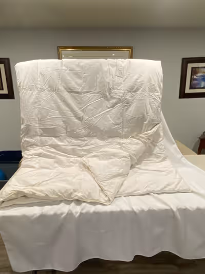 This is a King Size Feather Duvet, perfect for adding a layer of warmth and comfort to your bed duri...