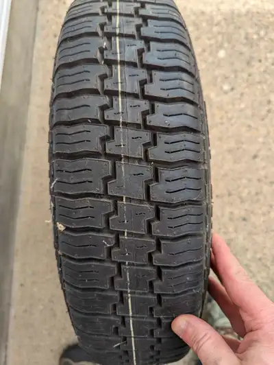 Good trailer tire good for a spell in good shape the name of the tile is carlisle 145 12 bolt pwtter...