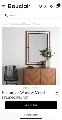 Mirror with wooden frame outside
