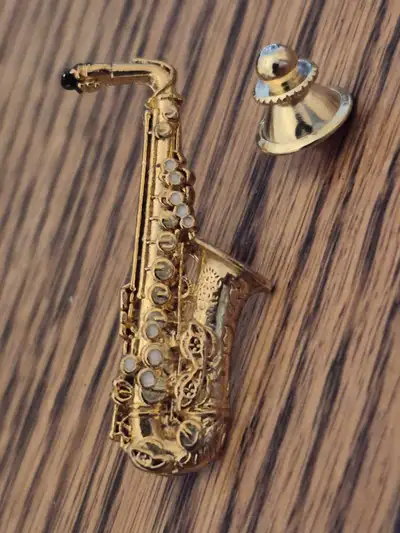 - made by Harmony Jewelry - detailed piece, black enamel mouth piece, white enameling to individual...