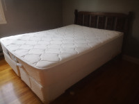 Used yet comfortable king sized bed with firm mattress