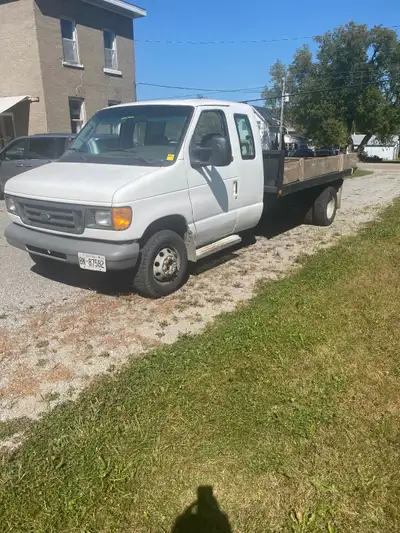 12’ steel checker plate deck, dual wheels good tires, solid running, performance , new windshield &...