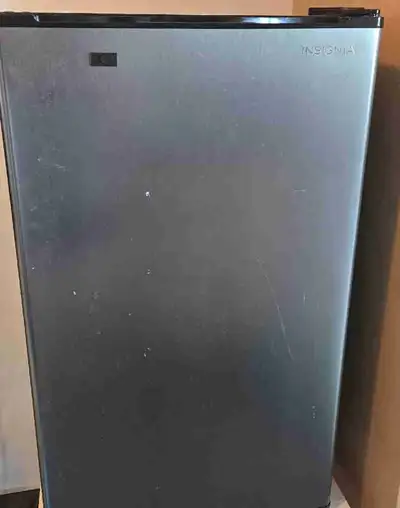 This Insignia compact refrigerator offers a sleek silver finish, perfect for your office, dorm room,...
