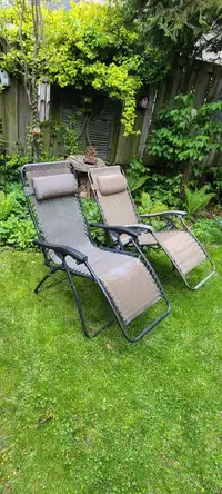 2 Outdoor Reclining Chairs - (Zero Gravity Chairs) $25 & $20