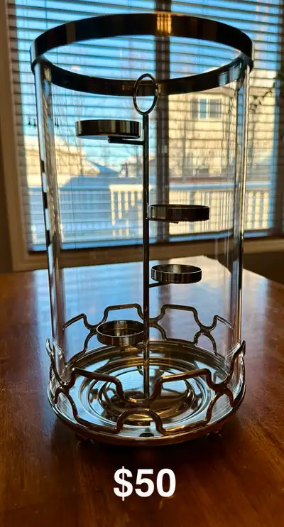 Designed for tealights, jar and pillar candles. Includes silvertone metal 4-tier tealight tree. Them...