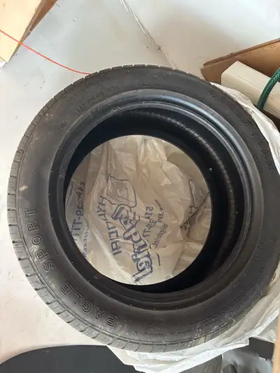 Selling a single Goodyear tire, size 235/50R17. This tire has seen some road time and is in a condit...