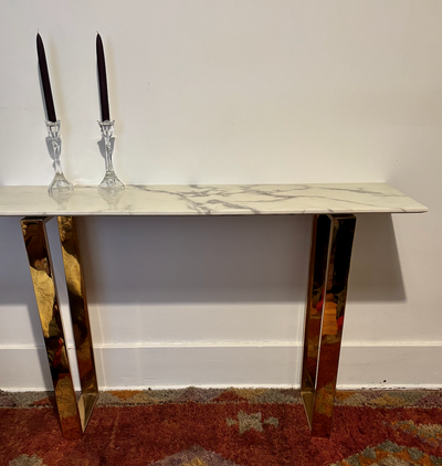 brass and quartz I believe... narrow and long enough behind a sofa or under a plant or as a desk ele...