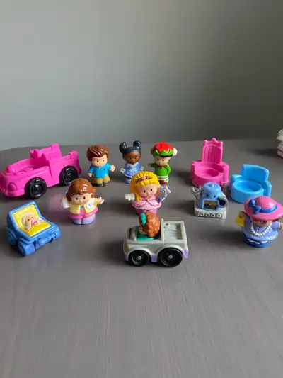 This is a lot of vintage Fisher-Price Little People figures and vehicles. It includes people, a pink...