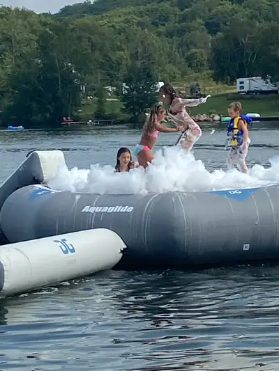 Get ready for some serious fun with this used Aquaglide water trampoline! Perfect for making a splas...
