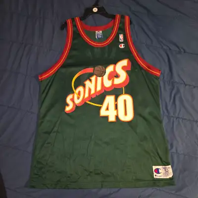 Selling a vintage Champion NBA jersey of Shawn Kemp, formerly of the Seattle Supersonics. The jersey...
