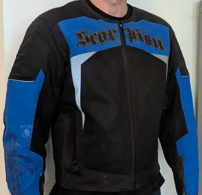 I'm selling a used Scorpion EXO black and blue motorcycle jacket, size large, perfect for staying pr...