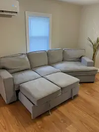 (Free delivery)  grey sectional with pullout bed and storage 