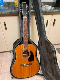12 string Epiphone like new   Case not included.