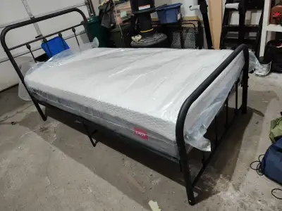 Black tubular frame twin bed, like new with lightly used 10" Endy mattress.