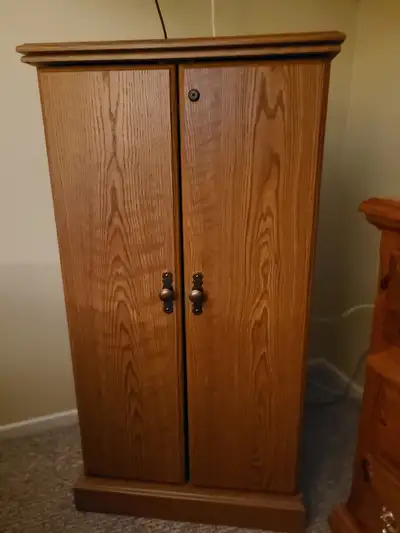 Solid wood DVD or CD cabinet in excellent condition. Lots of space