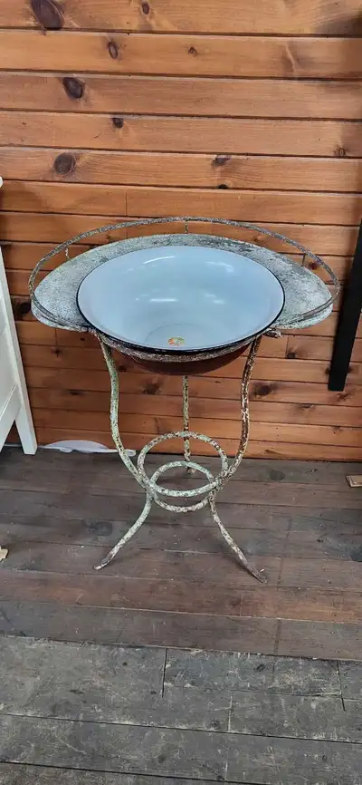 Beautiful patina on this antique metal wash stand. Ornate design, comes with enameled metal bowl. 24...