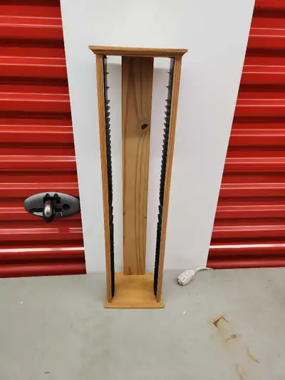 Keep your music collection organized with this standing CD rack. This rack, while showing signs of u...