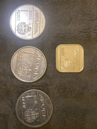 Selling a collection of Aruba Florin coins. These coins are in used condition as they have been in c...