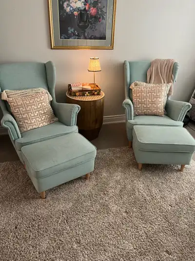 IKEA Strandmon chairs with matching ottomans Light blue/green colour Good condition Pet free , smoke...