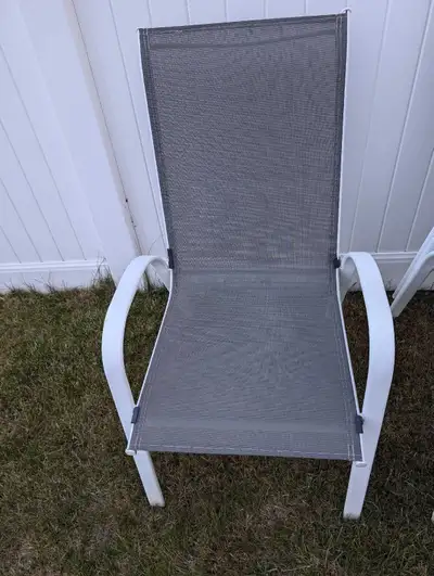 Refresh your outdoor relaxation with this set of four sling chairs, perfect for lounging by the pool...